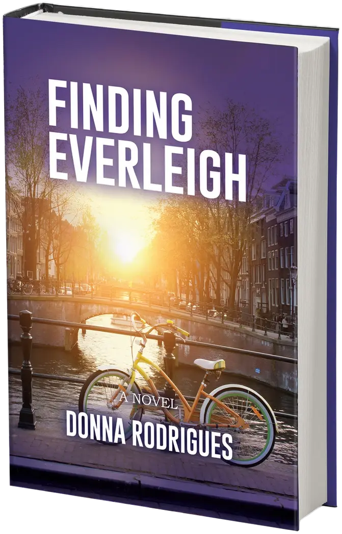 Finding Everleigh by Donna Rodrigues: a bicycle on an Amsterdam canal bridge at sunset